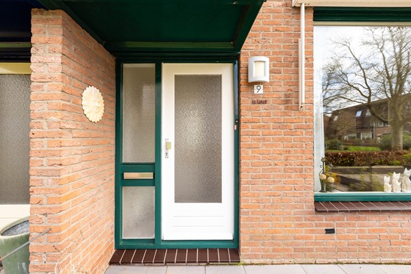 Foto - Te koop: tussenwoning gelegen aan groenvoorziening